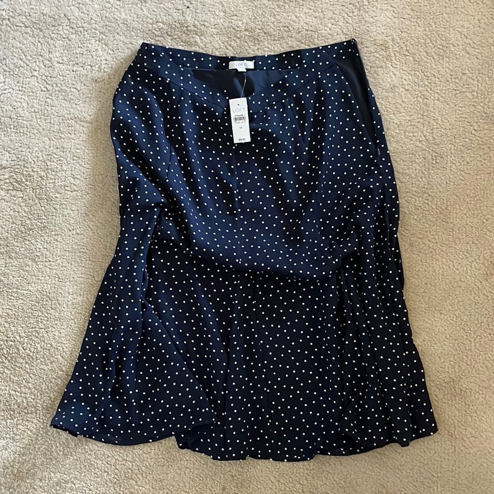 Polka dot shirt. Zips on the side. Brand new. From The Loft and a size 12